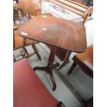 A 19th Century mahogany pedestal table having square top on turned column and triple splay feet,