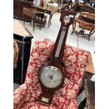 A late 19th Century mahogany cased banjo barometer having traditional silvered dial named James