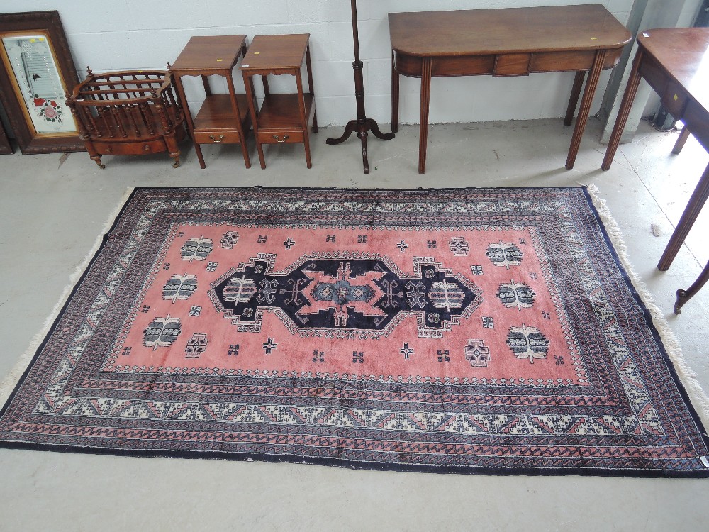 A 20th century Eastern design carpet square having salmon ground. approx 160 x 270cm (including