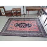 A 20th century Eastern design carpet square having salmon ground. approx 160 x 270cm (including