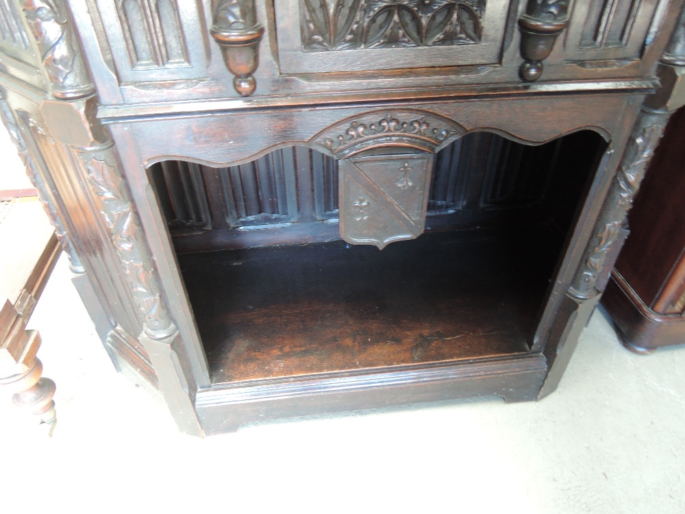 A late 19th century oak credence cupboard having extensive medieval style carved decoration with - Image 3 of 6