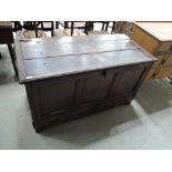 An 18th century oak mule chest having lift top with panel sides and two drawer base, width approx.