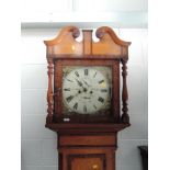 An early 19th golden oak and mahogany longcase clock having swan neck and spindle hood containing