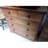 A Victorian mahogany chest of two short and three long drawers on plinth and bun feet