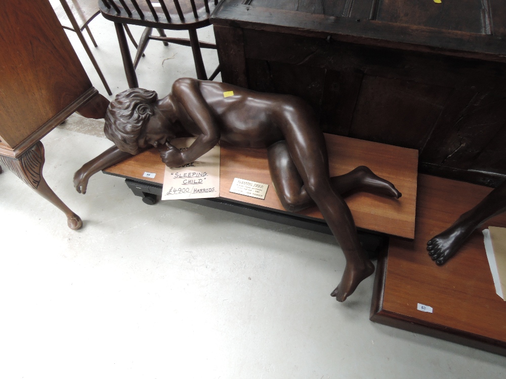 A 1980's Limited Edition bronze figure modelled as sleeping child by John Robinson, purchased from