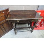 An 18th and later oak side table having rectangular top with frieze drawer and bobbin supports,