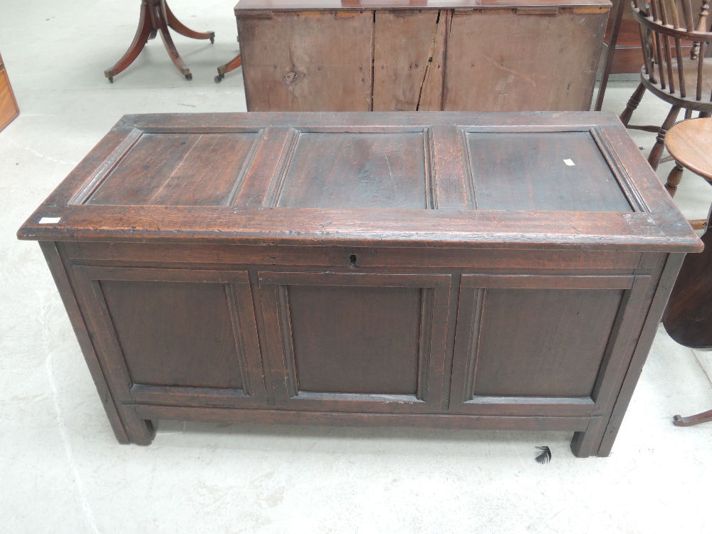 An 18th Century oak kist/coffer having panel sides and stile frame, width approx. 125cm