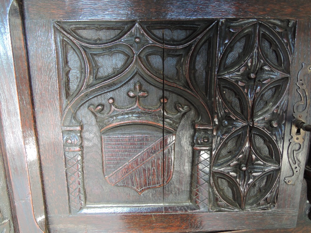 A late 19th century oak credence cupboard having extensive medieval style carved decoration with - Image 4 of 6