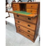 A 19th Century maghogany and satinwood campaign chest of military style having file drawers and