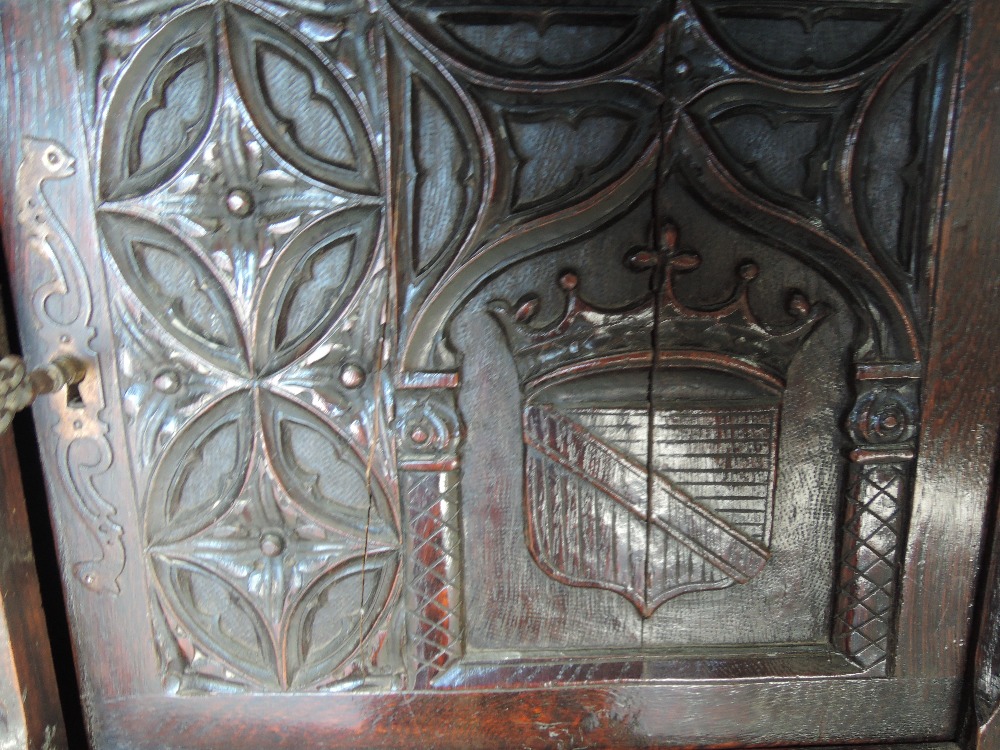 A late 19th century oak credence cupboard having extensive medieval style carved decoration with - Image 5 of 6