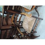 A composite set of four (2+2) early 19th century elm kitchen chairs, having wave ladder backs,