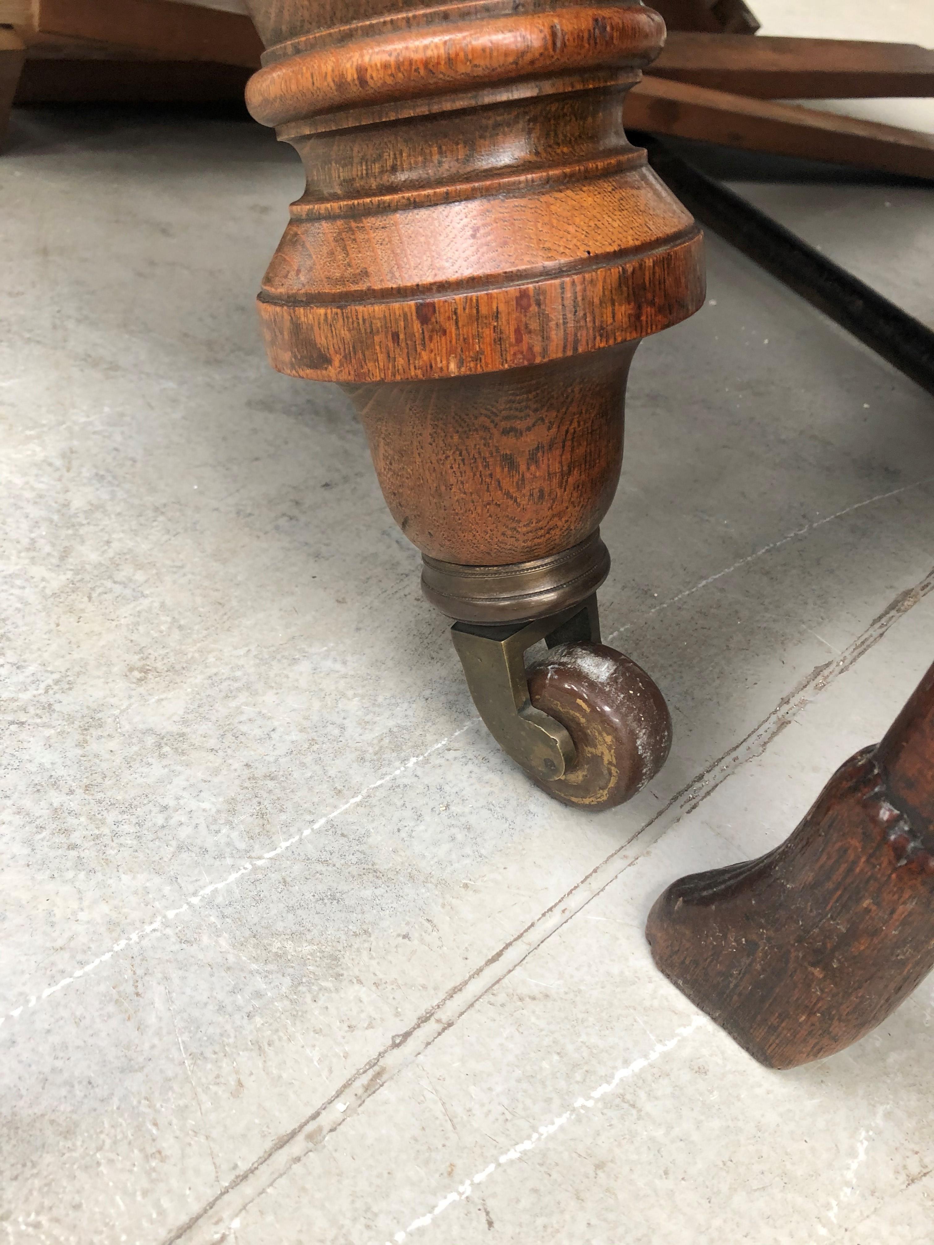 A late Victorian golden oak dining table on heavy turned legs with extra leaf, closed width approx - Image 2 of 4