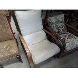 A 1930's oak frame armchair of Art Deco design with later cream upholstery, width approx. 62cm