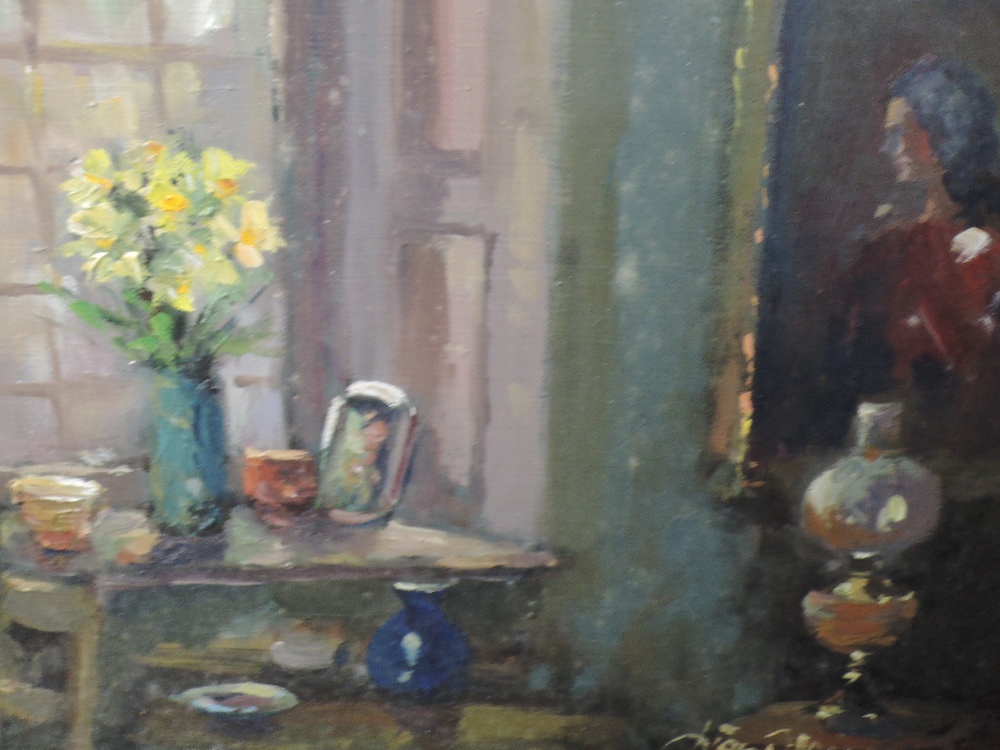 An oil painting, Liam Treacy, interior with lamp, signed and attributed verso