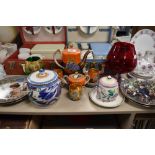 A small lot containing Poole pottery biscuit barrel , condiment pot and plate, also a part coffee