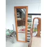 A modern pine wall mirror, hangings fixed for landscape but could be hung as full length, approx.
