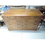 A reproduction light mahogany bedding box / tv cabinet modelled as chest of three over 6 drawers,