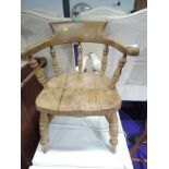 A traditional beech childs bow armchair, height to seat 29cm, width 44cm