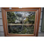 A framed Marion Bradley oil on canvas depicting a riverside scene with foxgloves to the fore