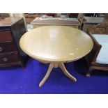 A modern golden oak topped circular dining table, diameter approx. 100cm