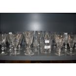 A selection of clear cut and crystal glass wares including named brands and Waterford