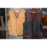 Two vintage leather waistcoats.