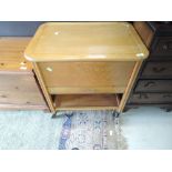 A vintage golden oak sewing trolley and contents, approx. width 62cm