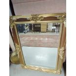 A modern worn gilt effect wall mirror, approx 88 x 66cm