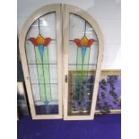 A pair of leaded and coloured glass arched doors, approx. 39 x 126cm each