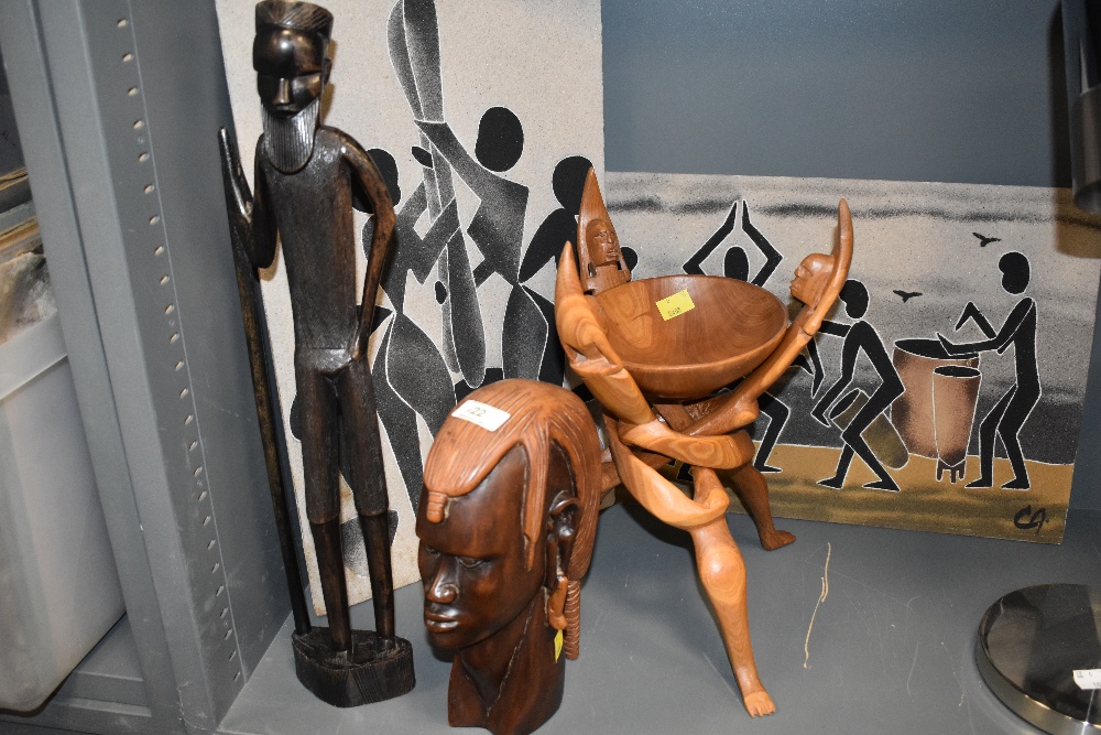 A selection of African tribal figures and figurines including two sand pictures