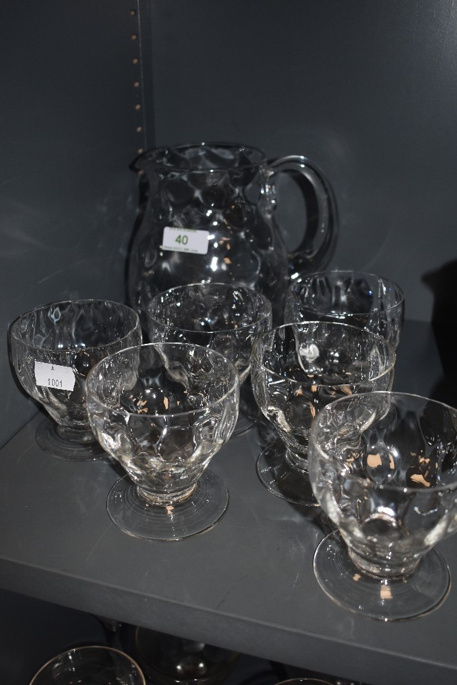 A set of six vintage glasses and a matching jug.