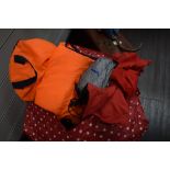 A large bag of childrens life jackets, waterproof jackets and similar, also included are some