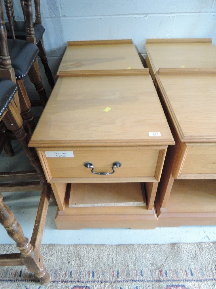 A pair of golden oak bedside cabinets (one with sticky label on front)