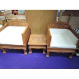 A pair of Thai hardwood throne style chairs, with matching occasional table, heavily carved elephant