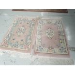 Two modern Chinese rugs, approx. 100cm x 60cm each (not including tassles)