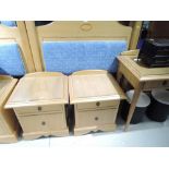 A modern golden oak single tester headbord and pair of bedside cabinets