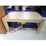 A modern part oak dining table