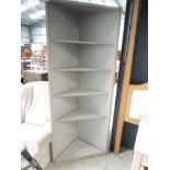 A laminate corner shelf, approx width 76cm, height 183cm