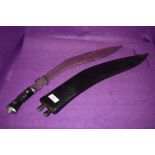 A Ghurkas Kukri in sheath.