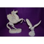 Two moulded resin studies one a pegacorn and the other an eagle.