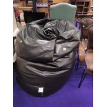 An oversized leatherette beanbag