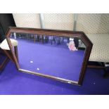 A mahogany effect wall mirror, approx. dimensions 103 x 73cm