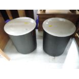 A pair of modern padded floor stools