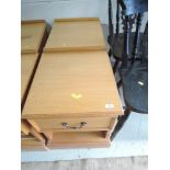 A pair of golden oak bedside cabinets