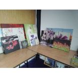 A large selection of canvas prints, mainly floral