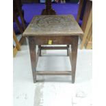 A rustic carved stool