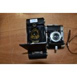 Two folding cameras A Baldinette and a Kodak No2 Autographic Brownie