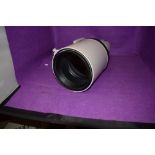 A Canon EF 600mm 1:4 IS USM lens with cover and hard carry case