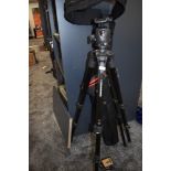 A Manfrotto carbon MT057C3G fibre tripod with levels and ball head in soft carry bag and Manfrotto