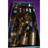 A box of brass lenses and microscope parts